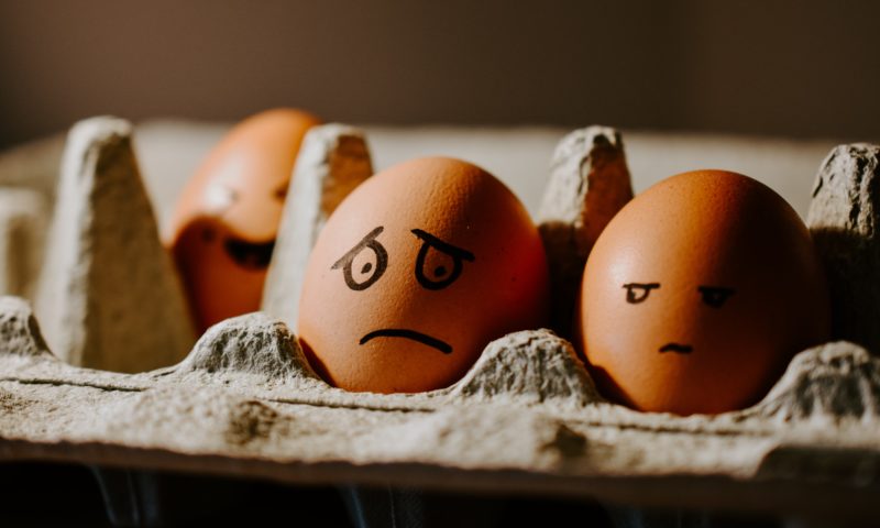 Pack of eggs with faces