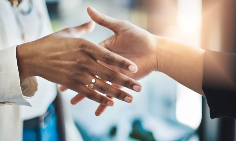 handshake between two people